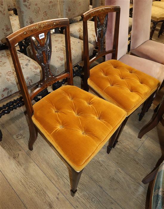 A pair of Edwardian inlaid rosewood salon chairs